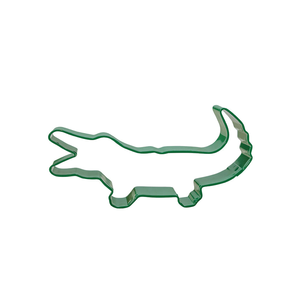 A green crocodile-shaped cookie cutter.