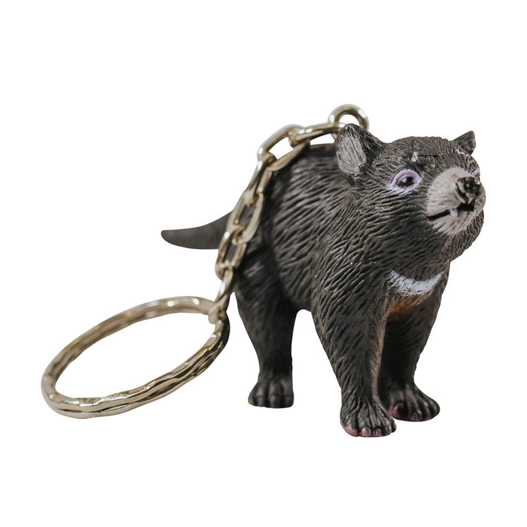 A small plastic Tasmanian devil toy with a keychain attached