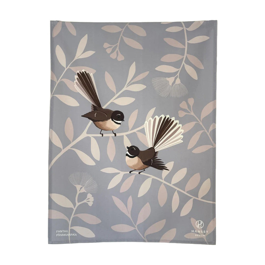 Fantail tea towel designed by artist Cathy Hansby features two Pīwakawaka