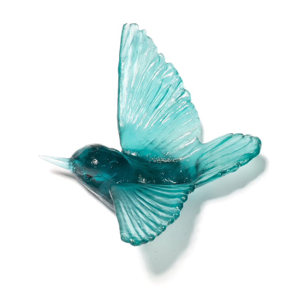 A translucent jade glass bird figurine with detailed wing and body textures, shown against a plain white background with a soft shadow.