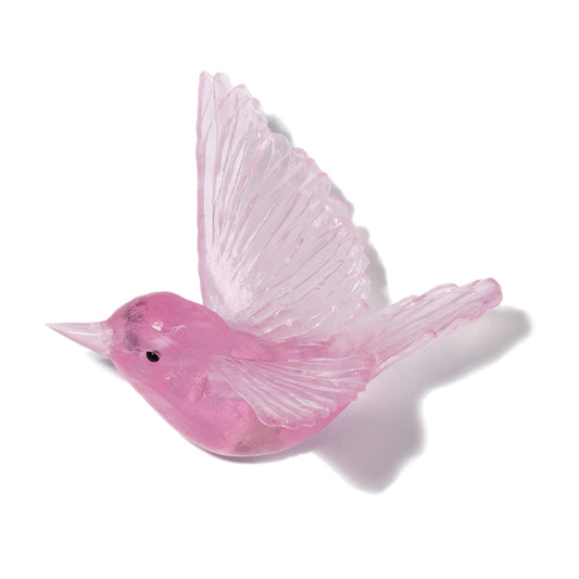 A translucent pink bird figurine with spread wings, shown on a clean white background with a soft shadow.