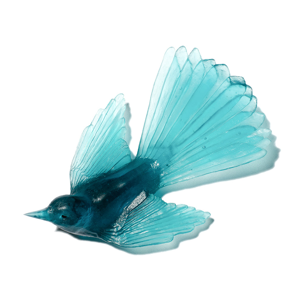A translucent blue glass bird figurine with spread wings, shown on a plain white background.