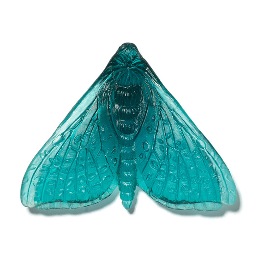 A translucent turquoise blue glass moth ornament with detailed wing patterns, shown against a plain white background.