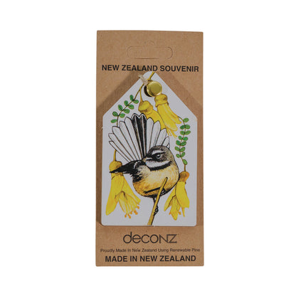 A Christmas decoration featuring a fantail bird and kowhai flower design, with the text 'Made in New Zealand' at the bottom.